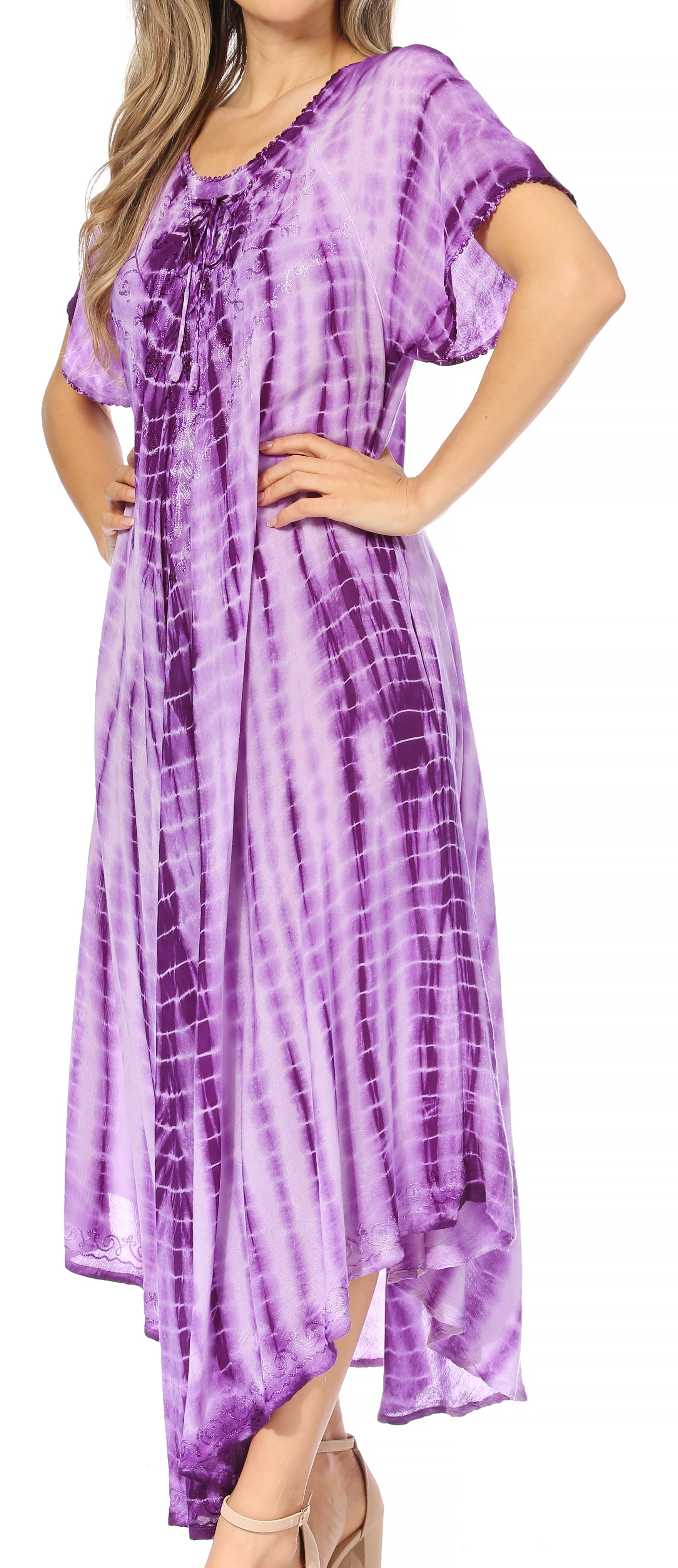 Woman wearing a purple tie-dye dress with short sleeves.