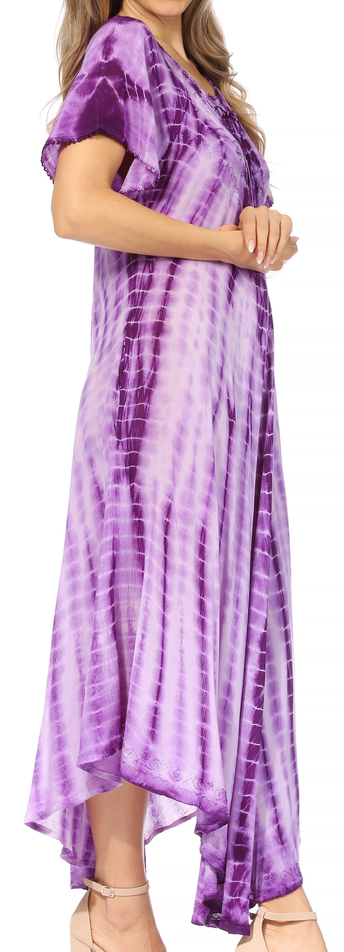 Woman wearing a purple tie-dye dress with a blurred background