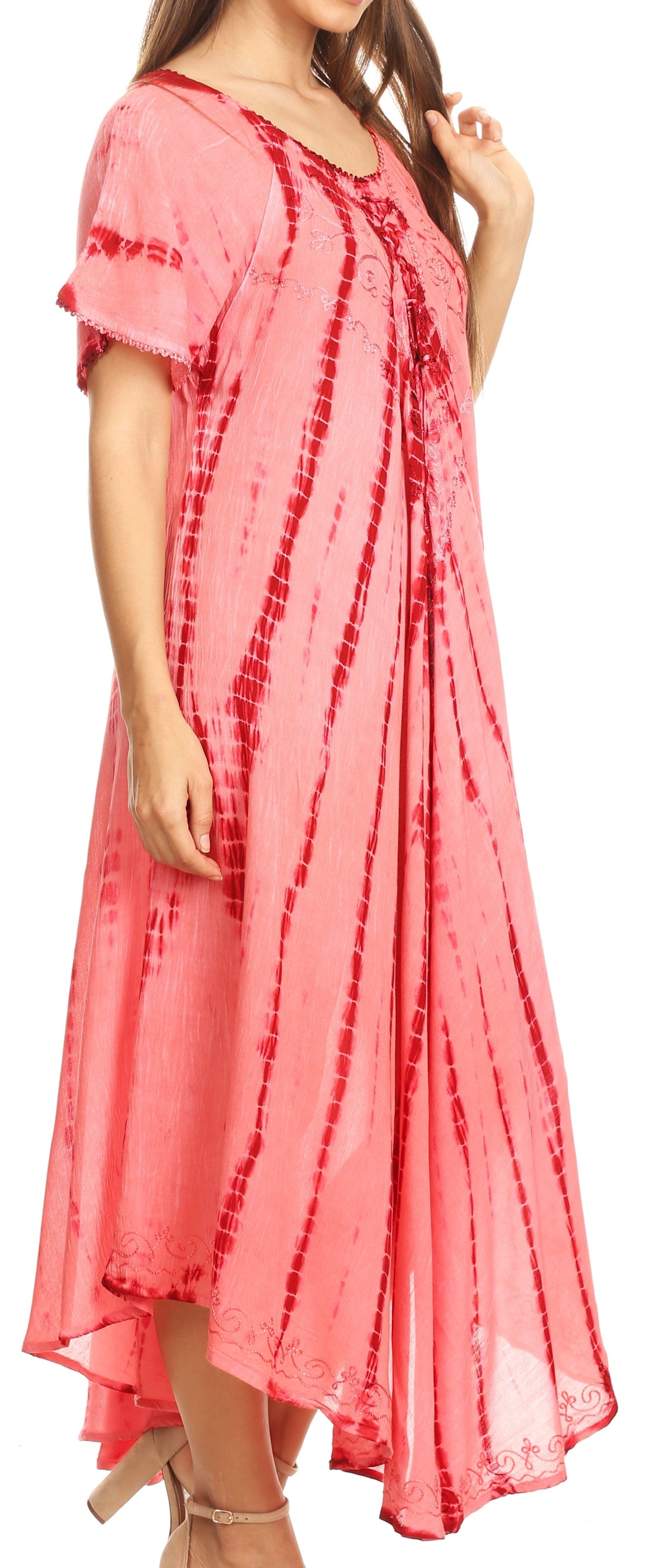 Woman wearing a pink tie-dye dress with a blurred background
