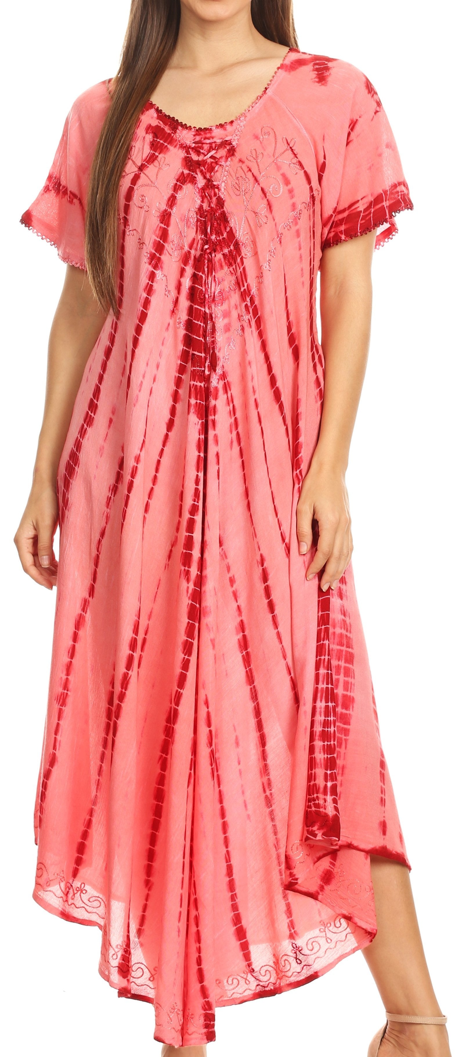 Woman wearing a pink tie-dye dress with lace details.