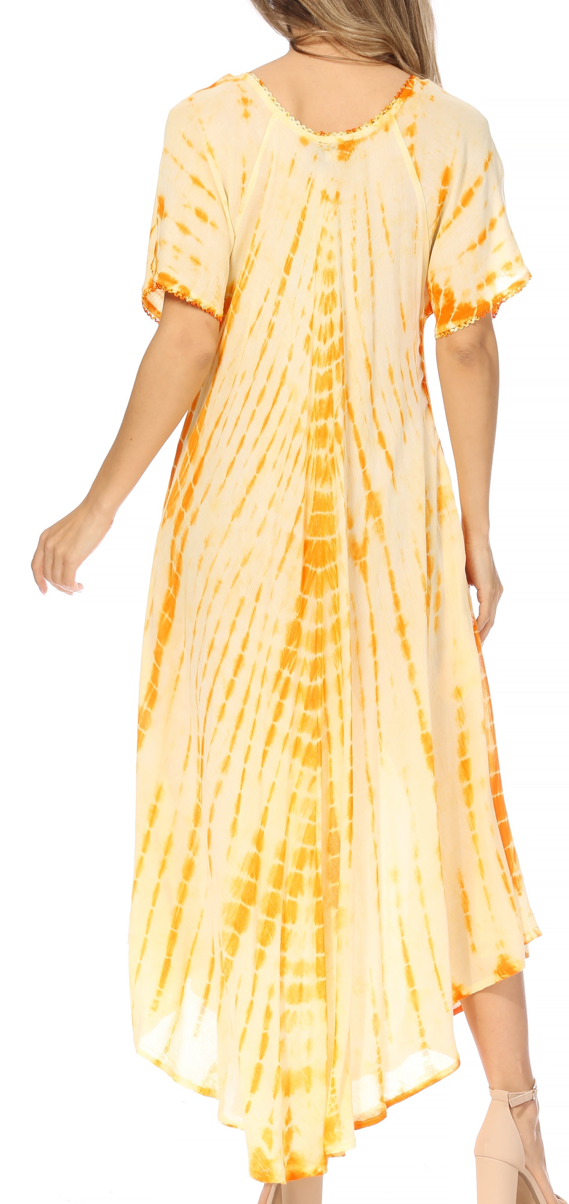 Woman wearing a yellow tie-dye dress on a white background