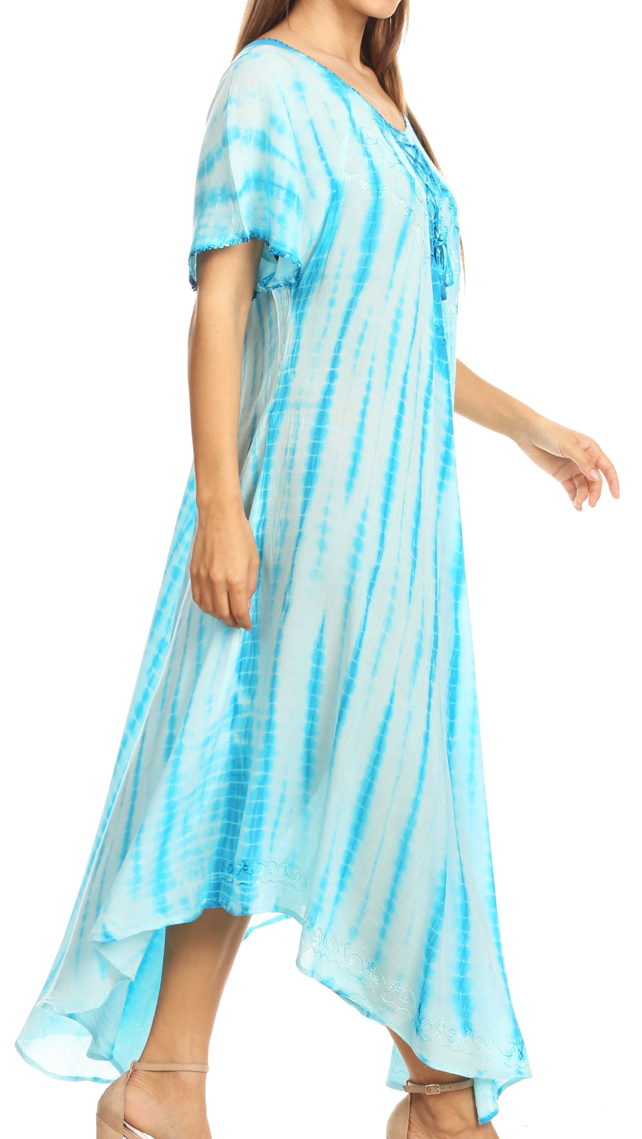 Woman wearing a blue tie-dye dress on a white background