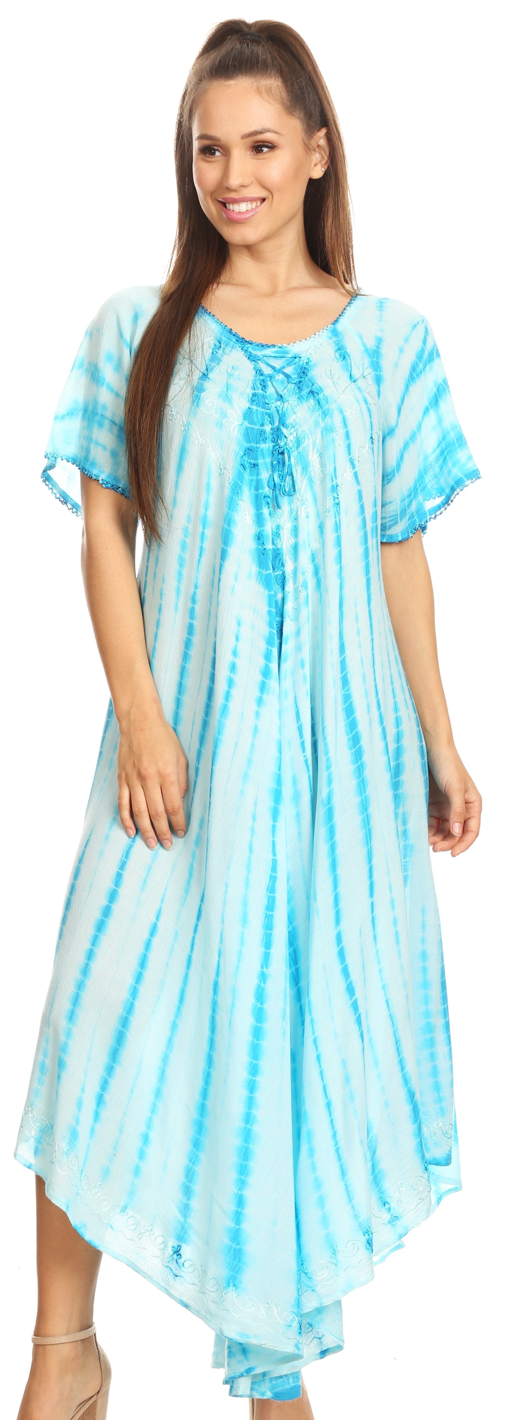 Woman wearing a blue tie-dye dress against a white background