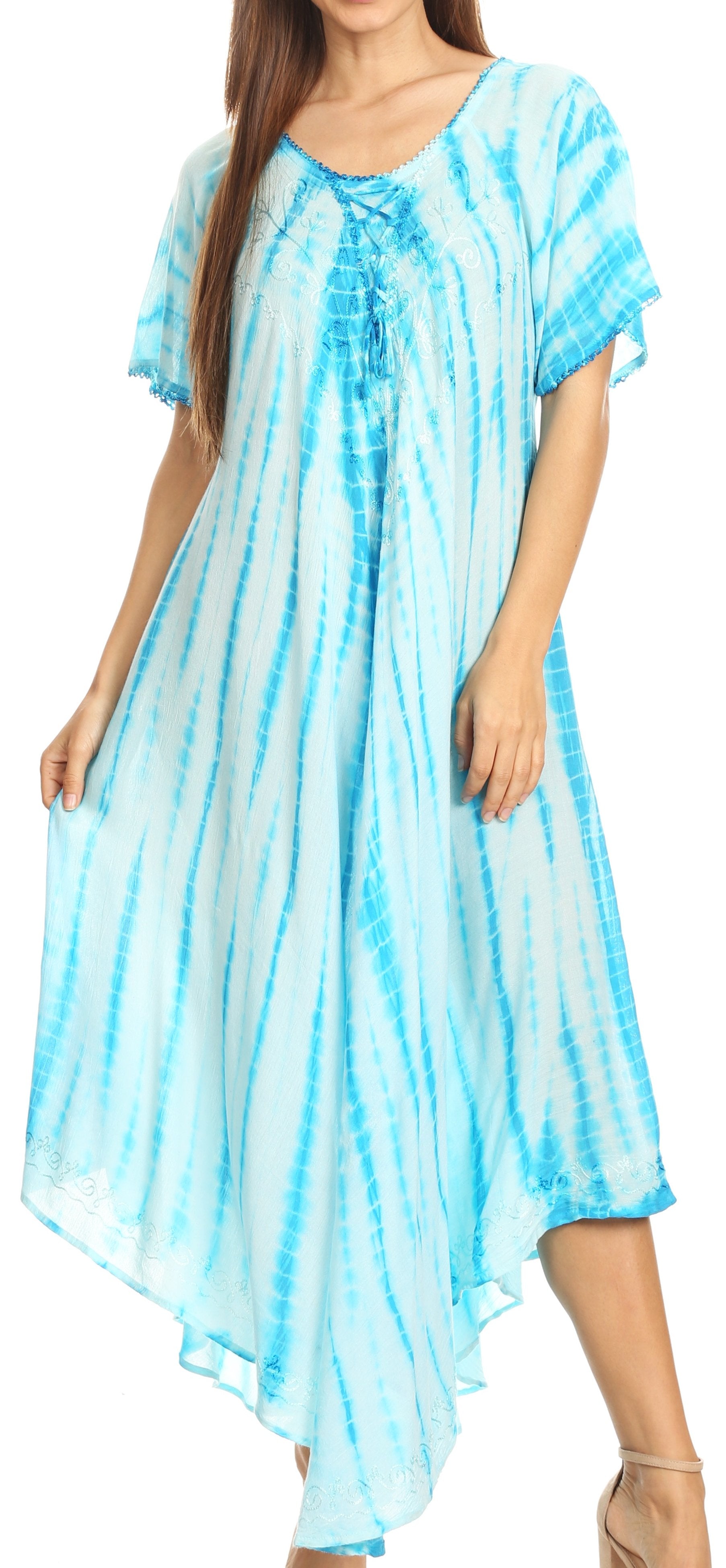 Woman wearing a blue tie-dye dress with a flowing design.