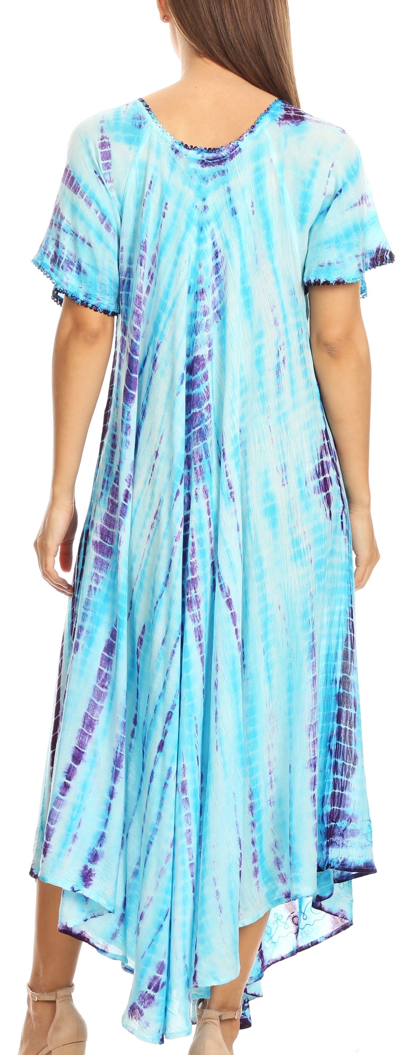 Woman wearing a tie-dye dress with short sleeves and an open back.