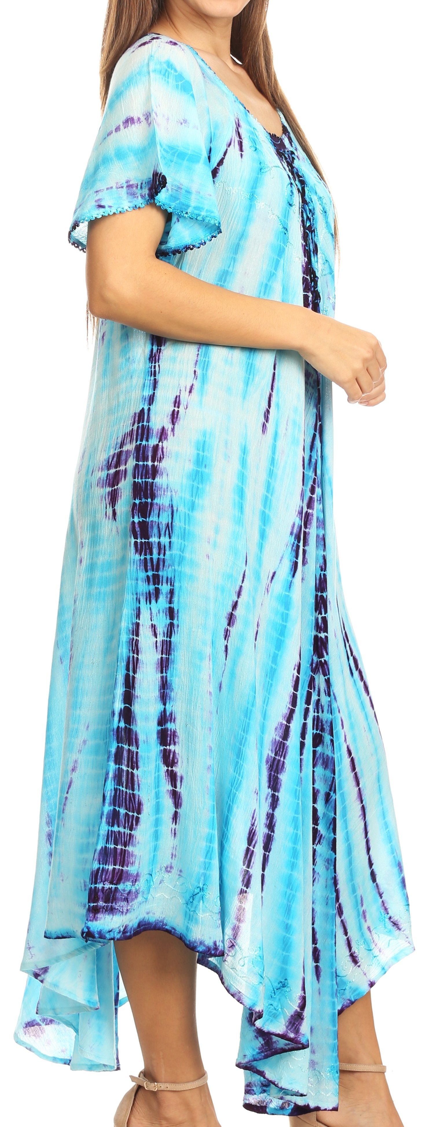 Woman wearing a tie-dye dress with blue and purple patterns.