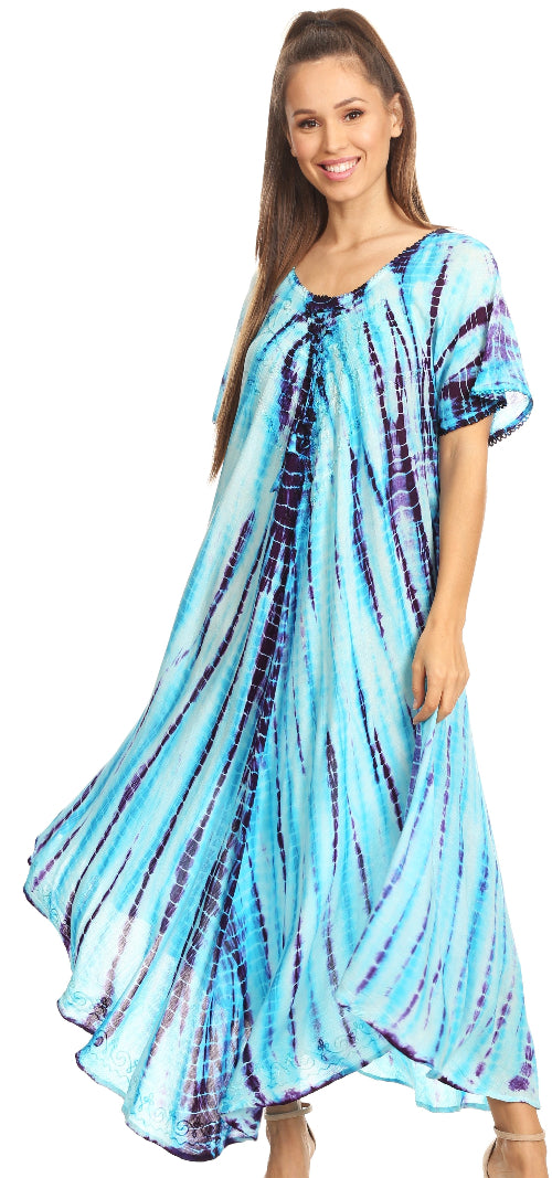 Woman wearing a blue tie-dye dress on a white background