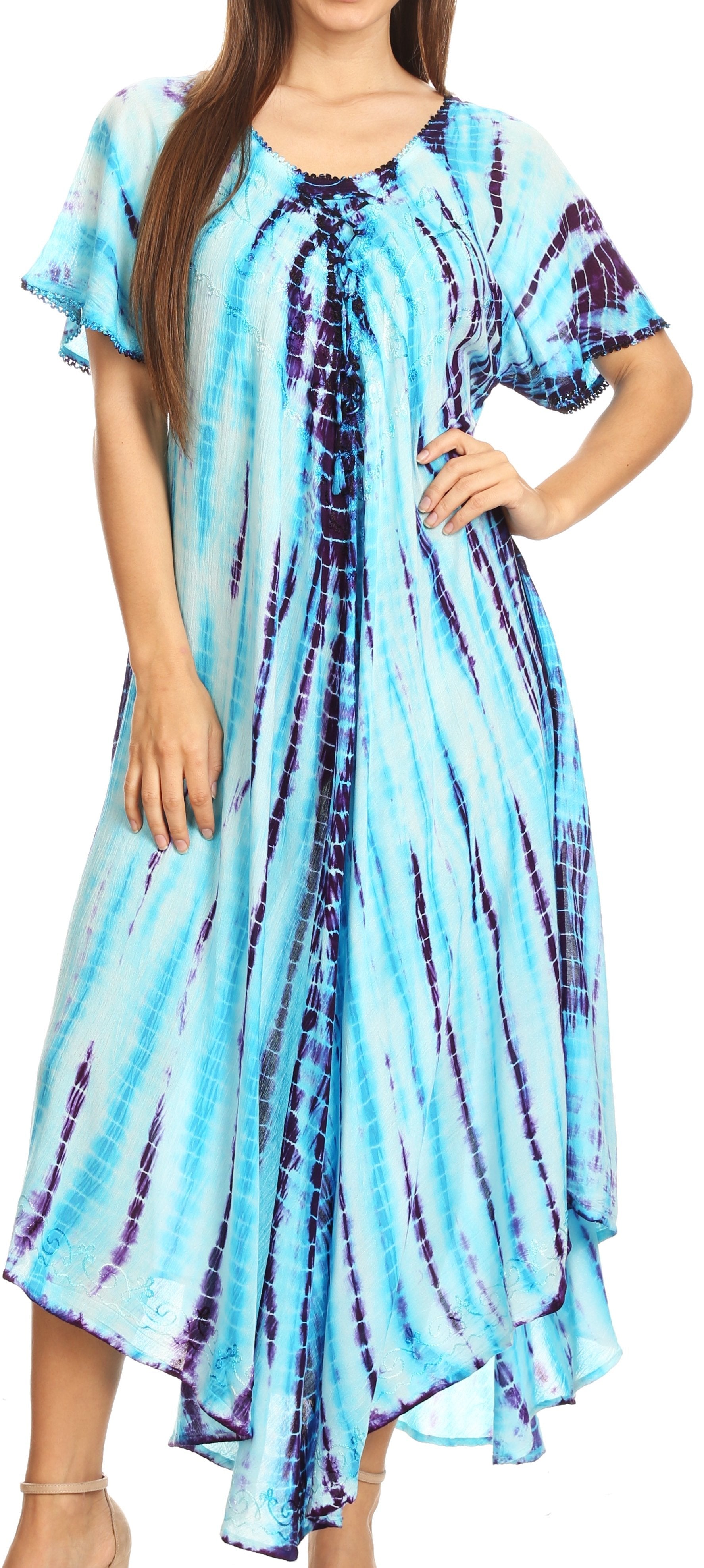 Woman wearing a blue and purple tie-dye dress against a white background