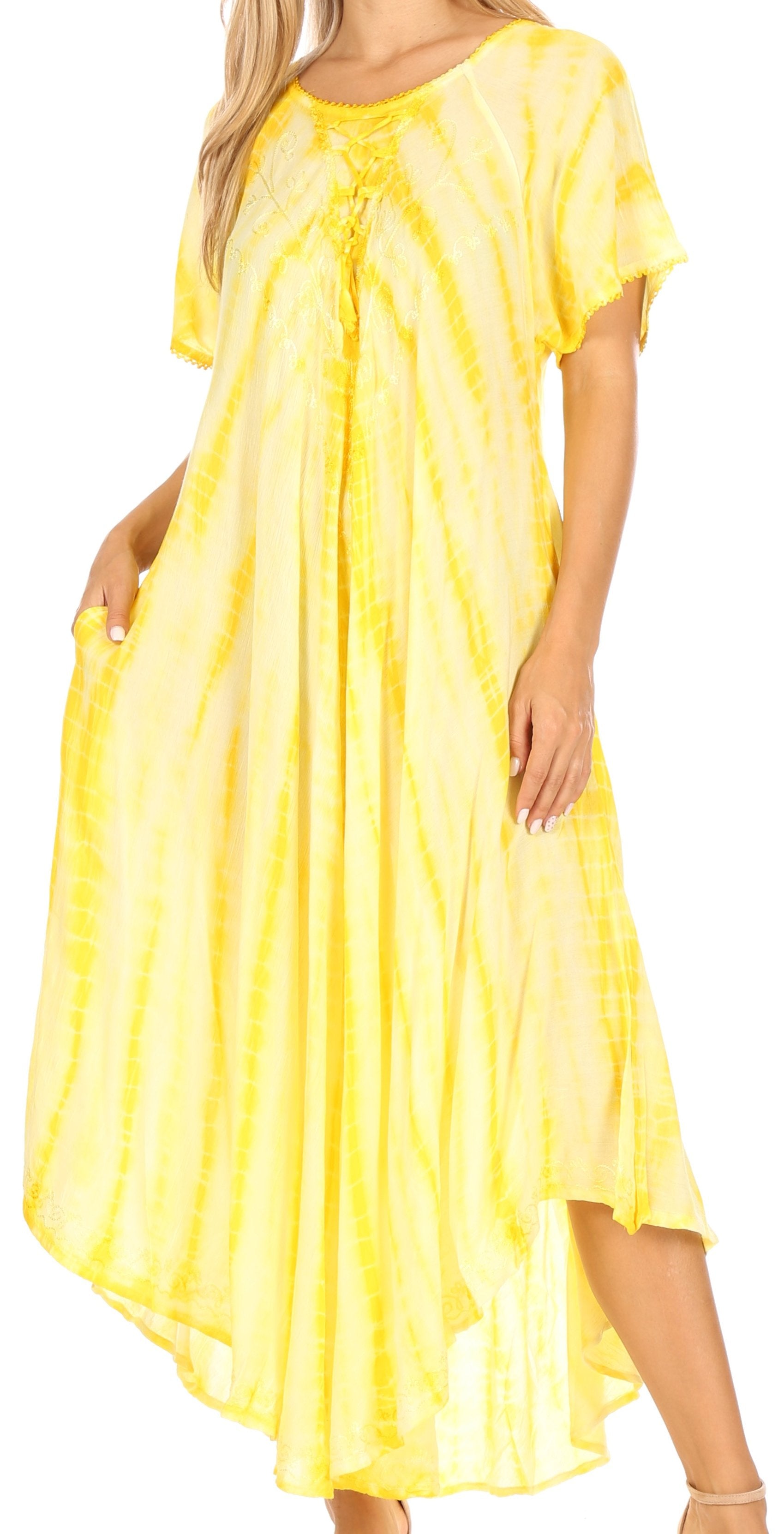 Woman wearing a yellow tie-dye dress on a white background