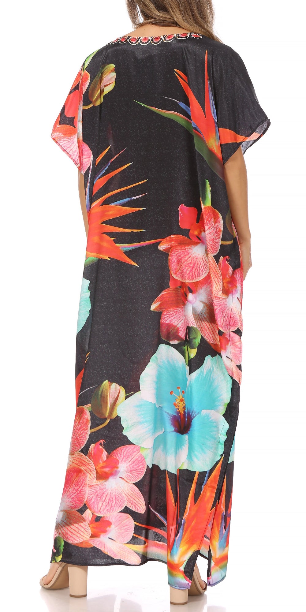 Black dress with colorful floral pattern worn by a person on a white background
