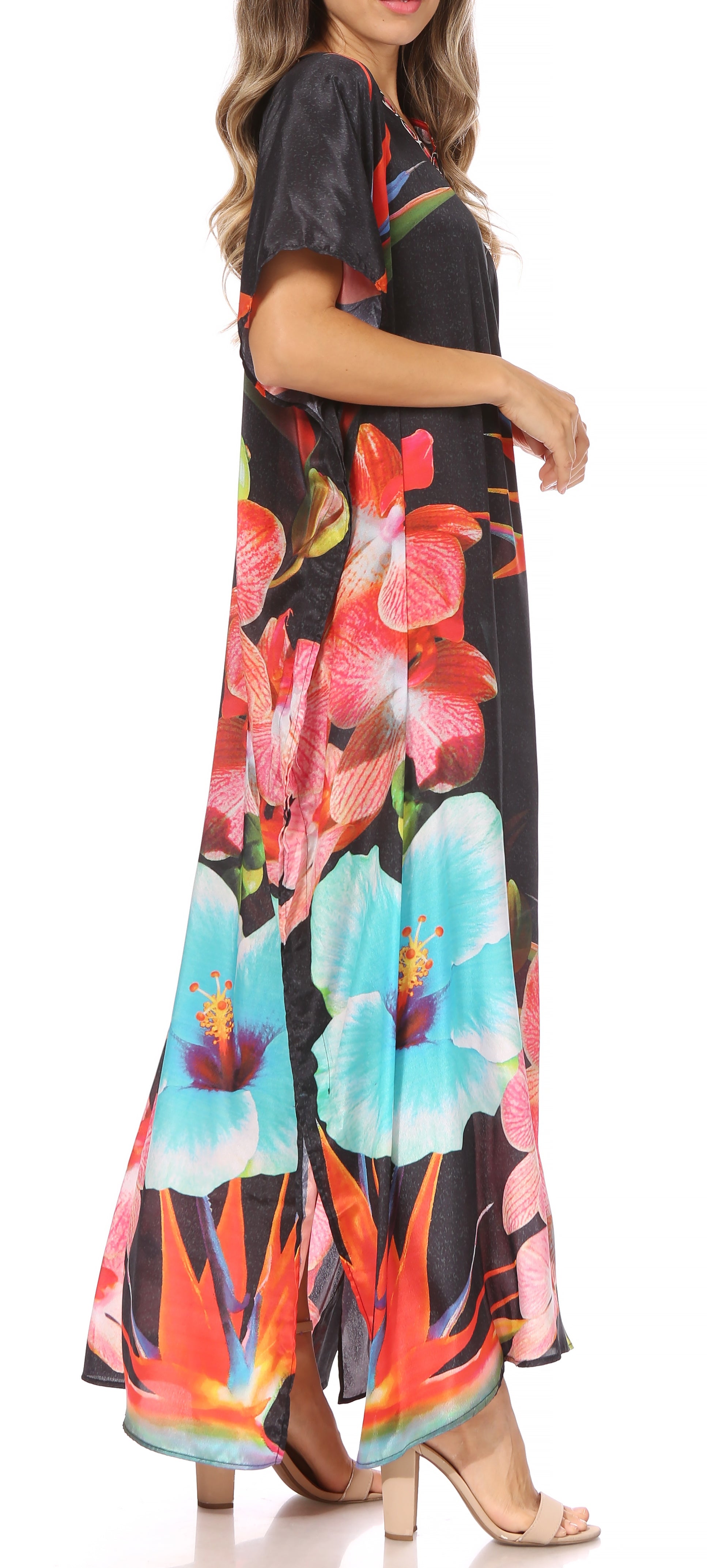 Woman wearing a colorful floral dress with a black background