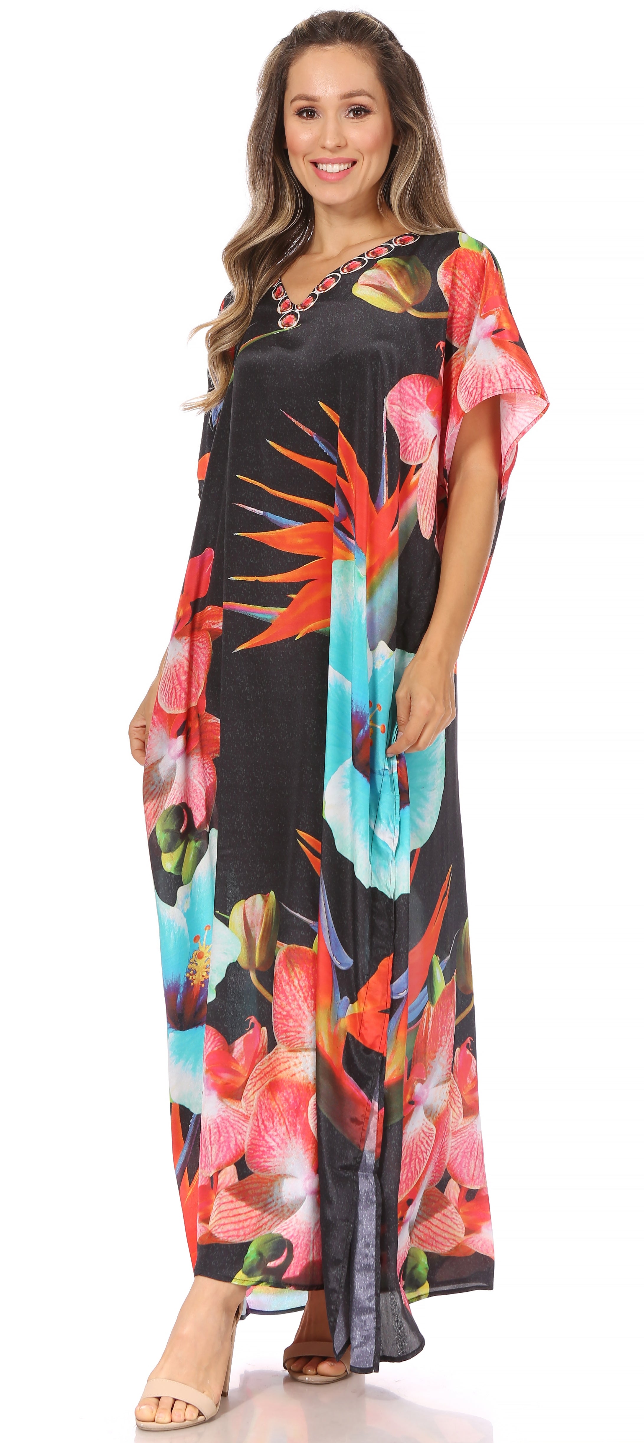 Woman wearing a colorful floral dress with a black background
