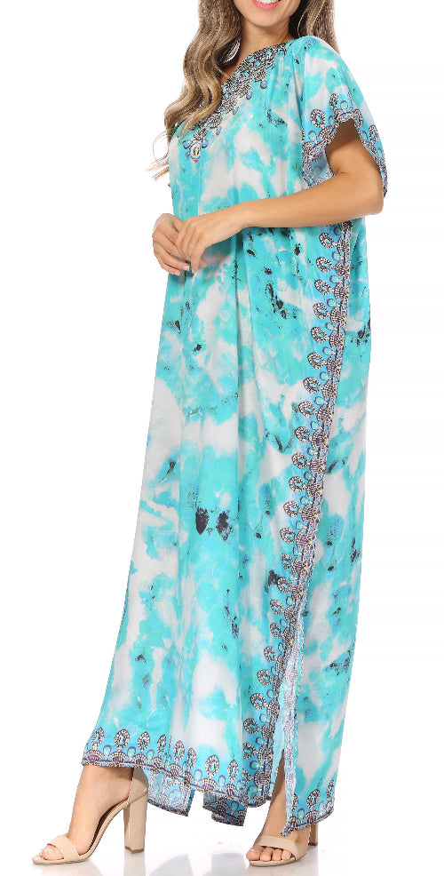 Long turquoise dress with floral pattern and embroidery on a white background