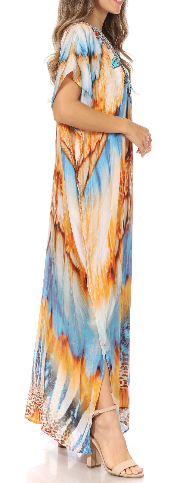 Woman wearing a colorful tie-dye dress with a blurred background