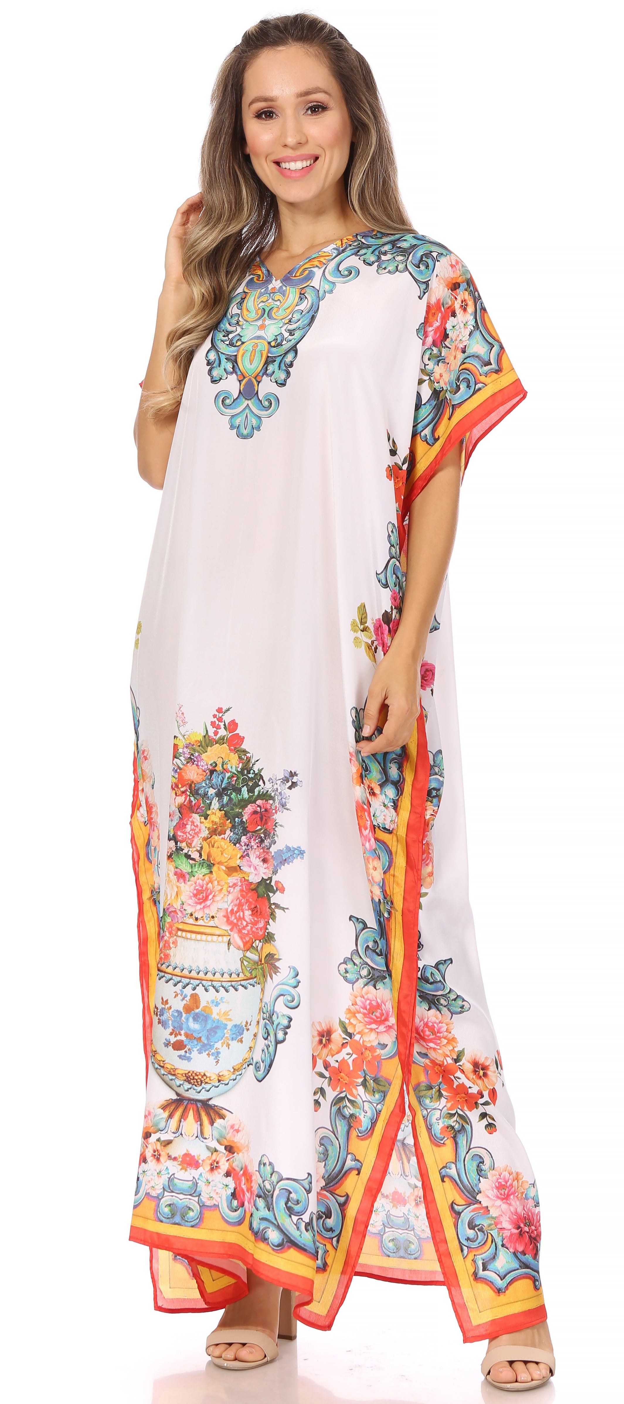 Woman wearing a long, colorful dress with floral patterns on a white background