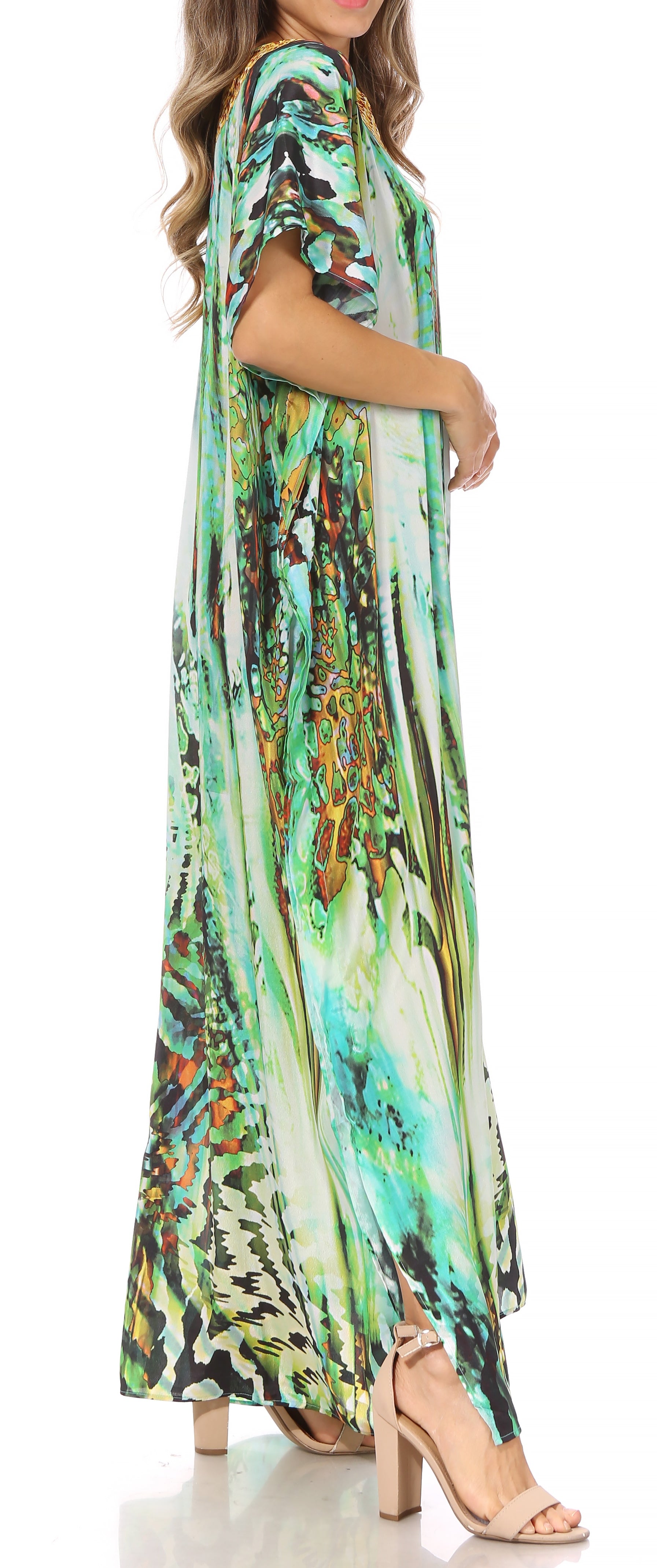 Woman wearing a colorful patterned dress with a white background