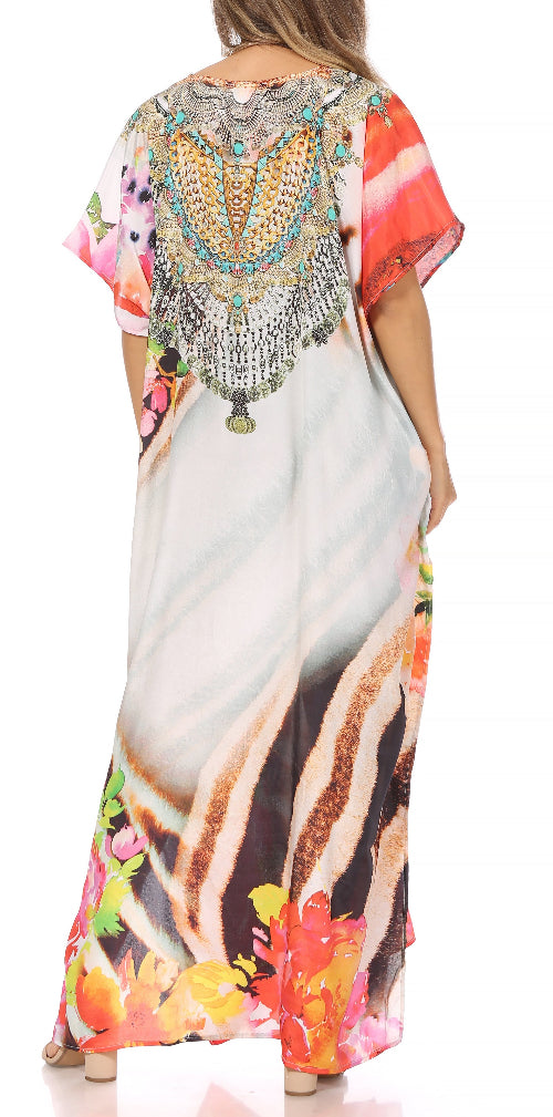 Colorful dress with floral patterns and embellishments on a white background