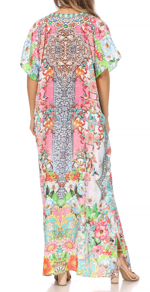 Woman wearing a colorful floral dress with a patterned back on a white background