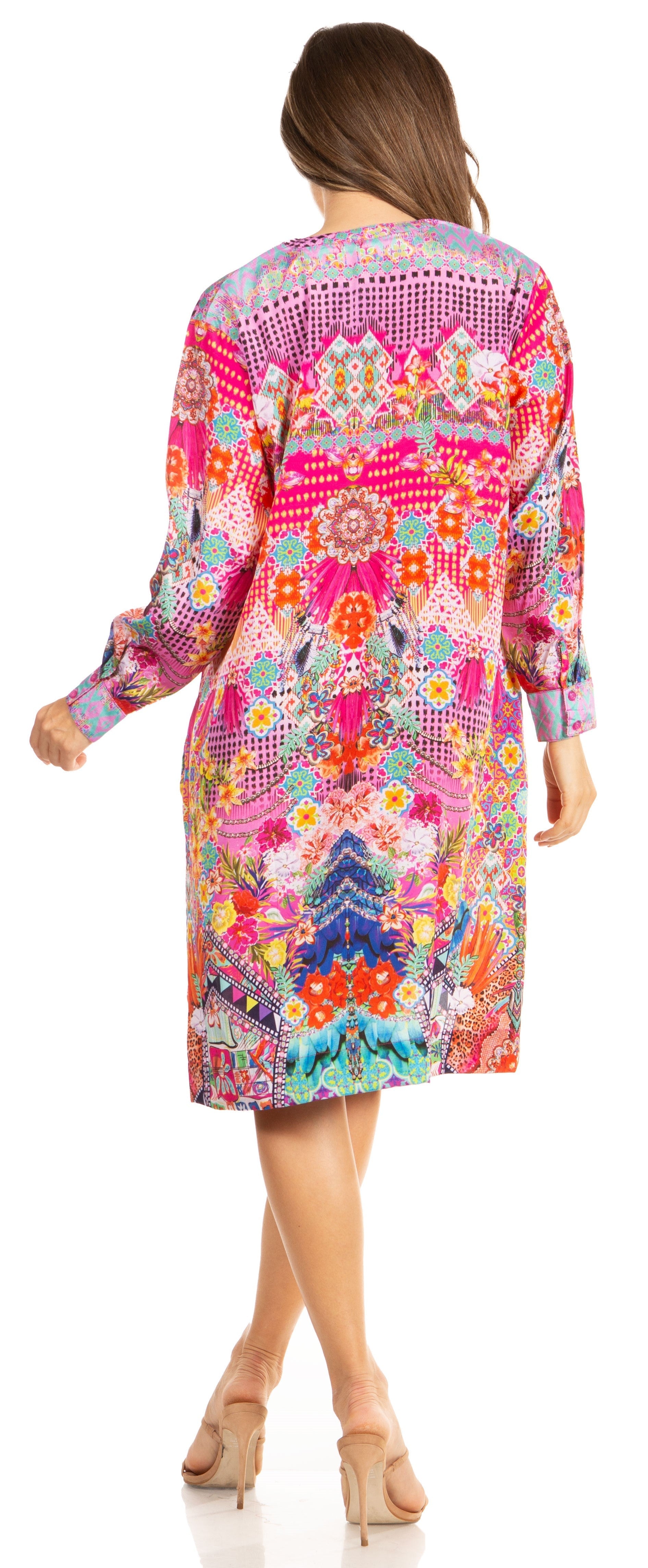 Woman wearing a colorful patterned dress on a white background