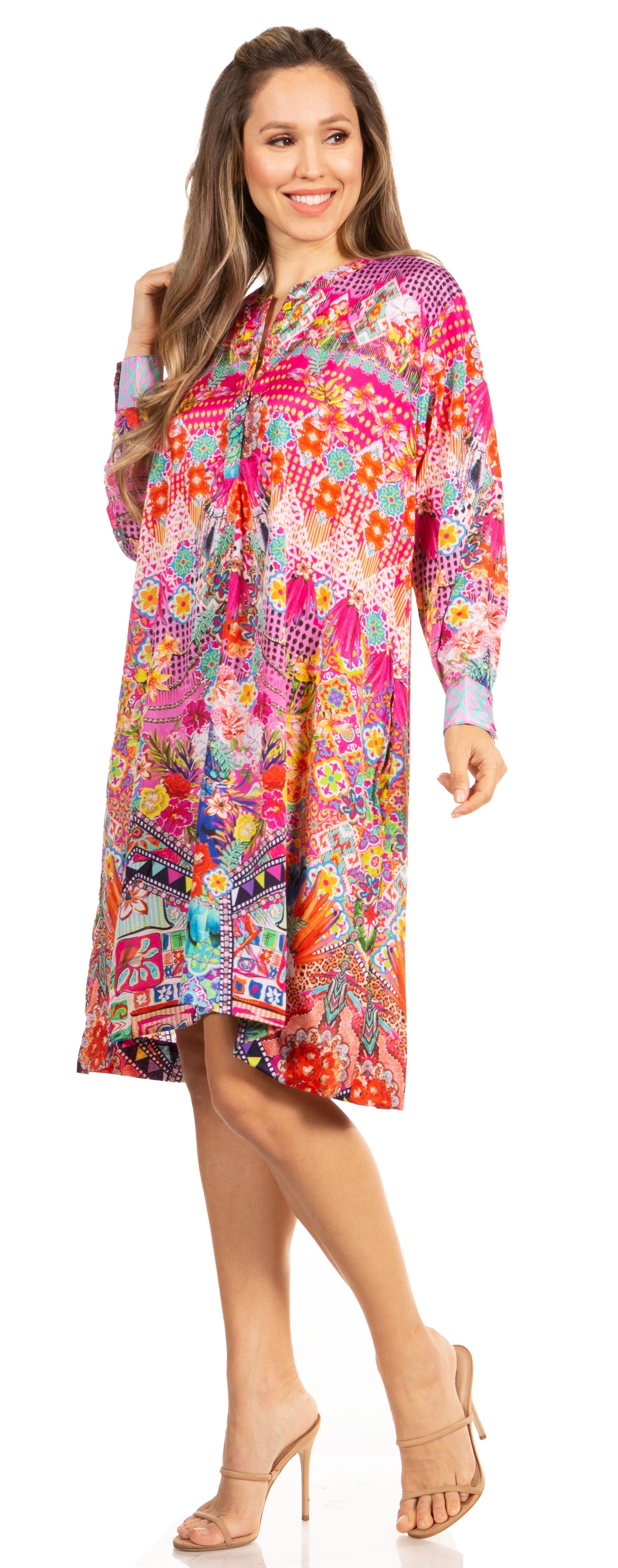 Woman wearing a colorful floral dress on a white background