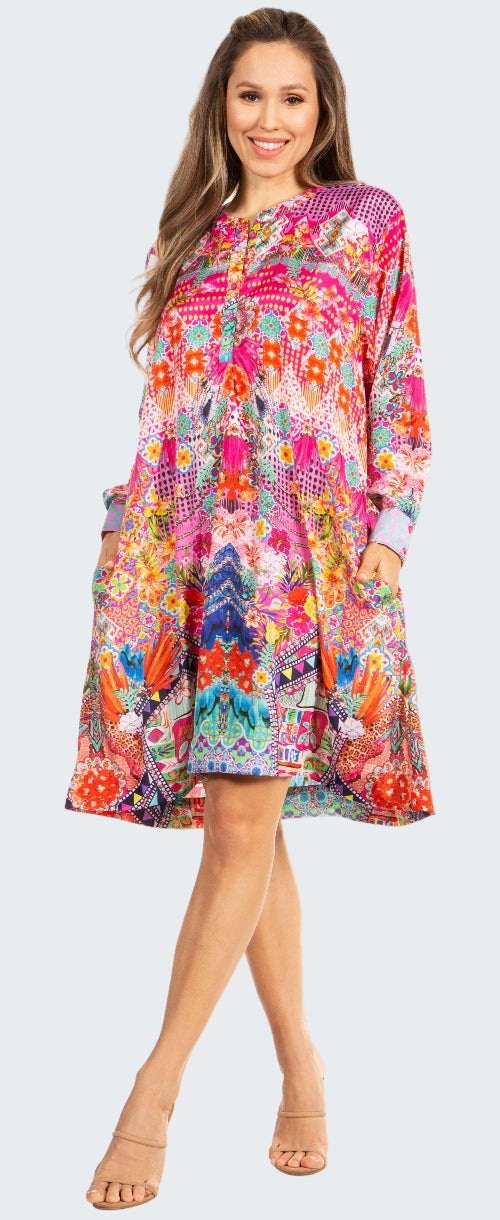 Woman wearing a colorful patterned dress on a white background