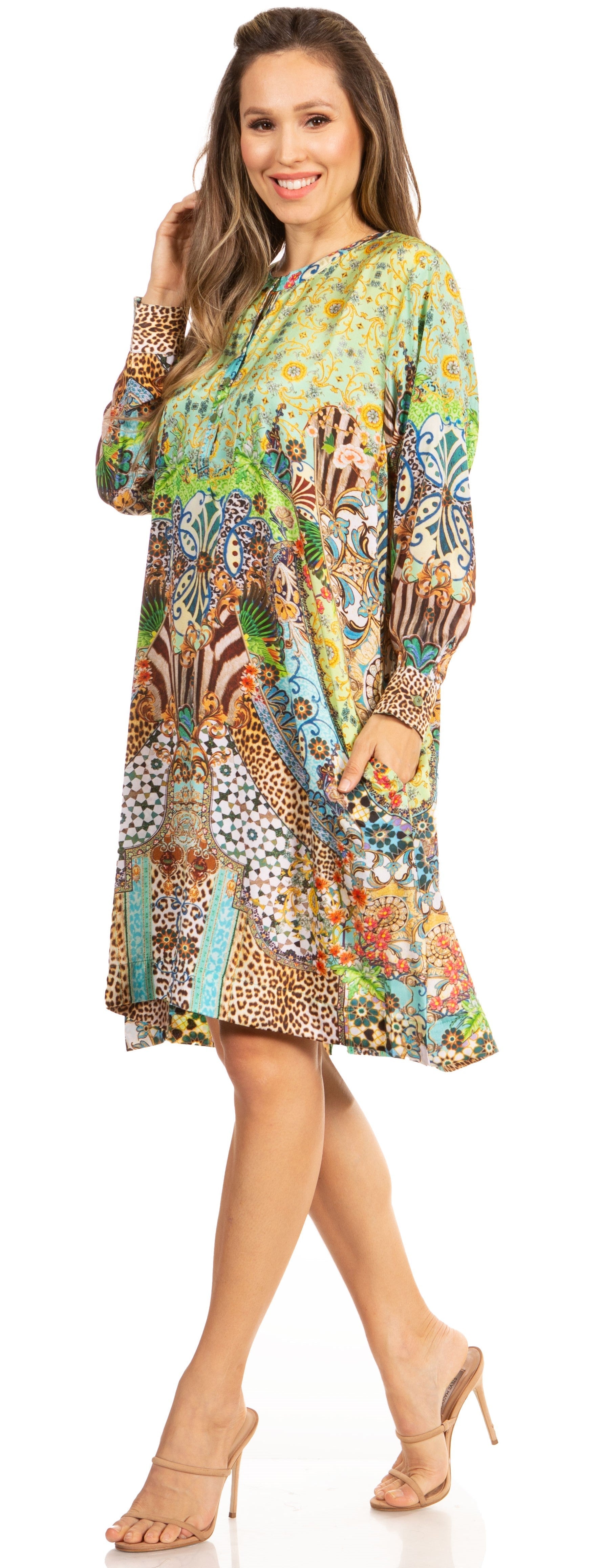 Woman wearing a colorful patterned dress on a white background