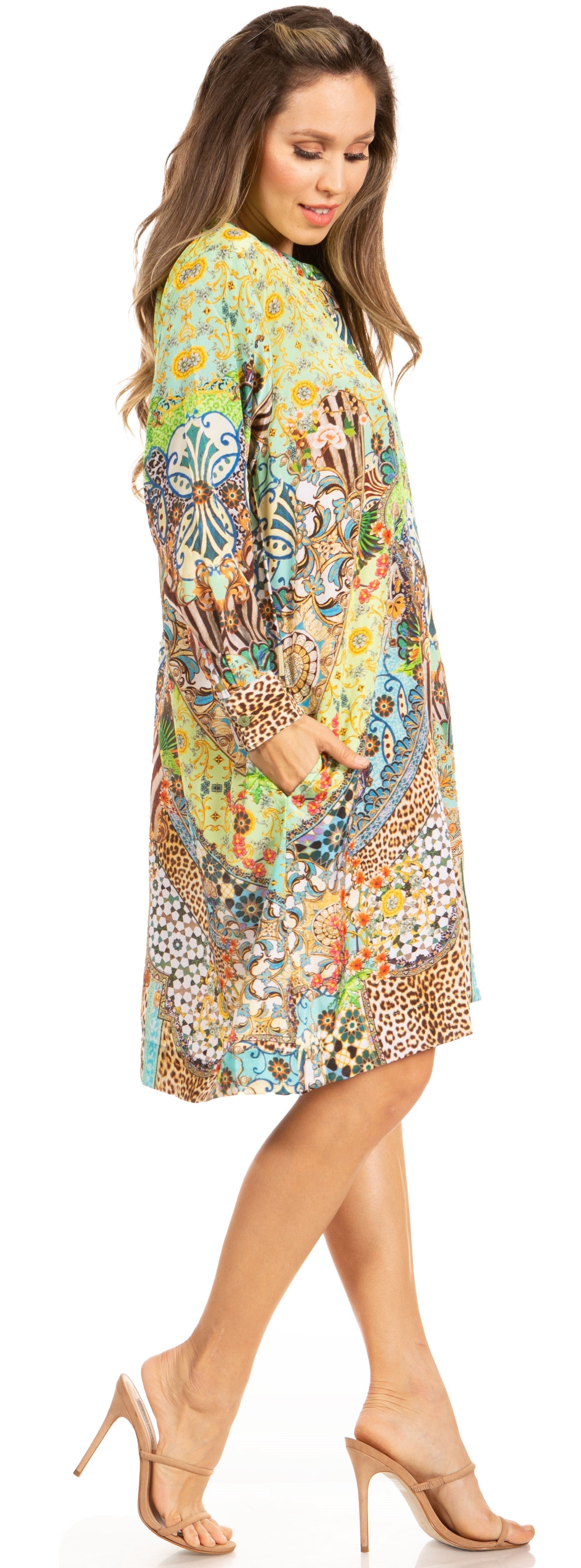 Woman wearing a colorful patterned dress on a white background