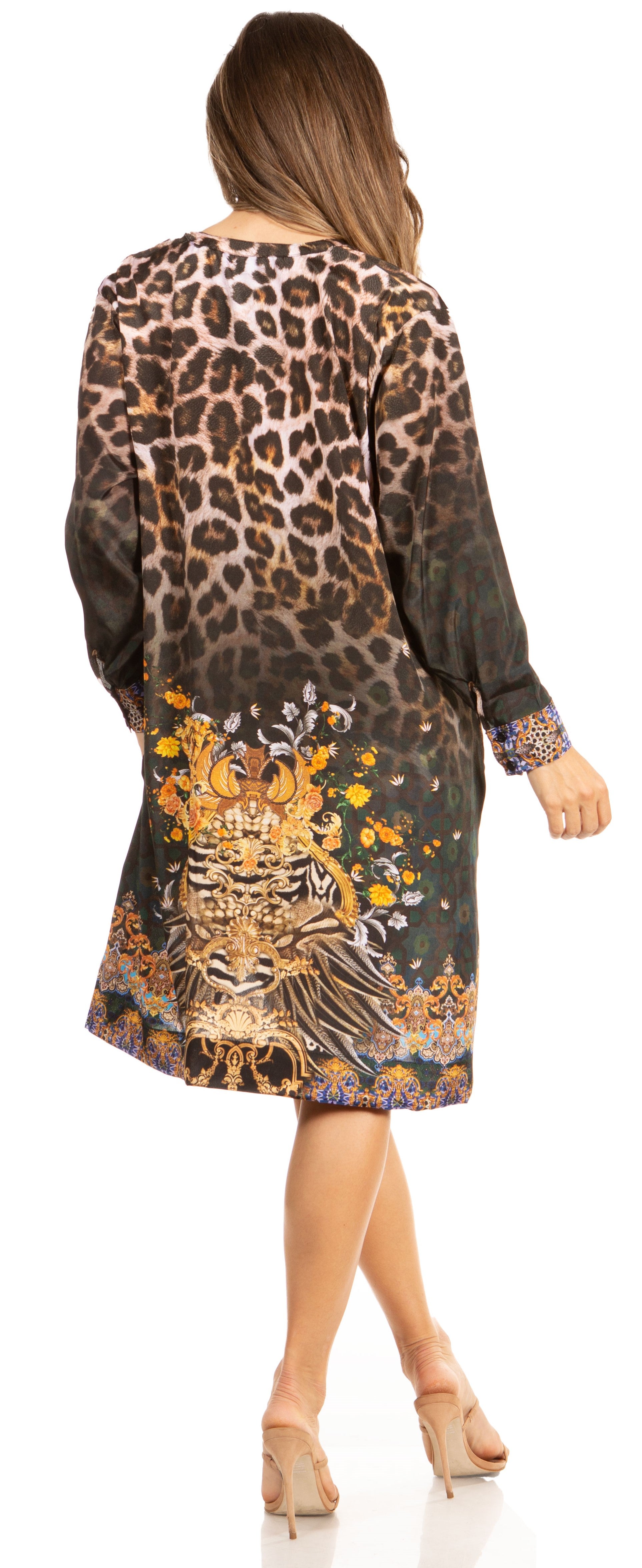 Woman wearing a leopard print dress with floral accents on a white background