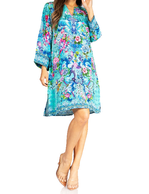 Woman wearing a colorful floral dress on a white background