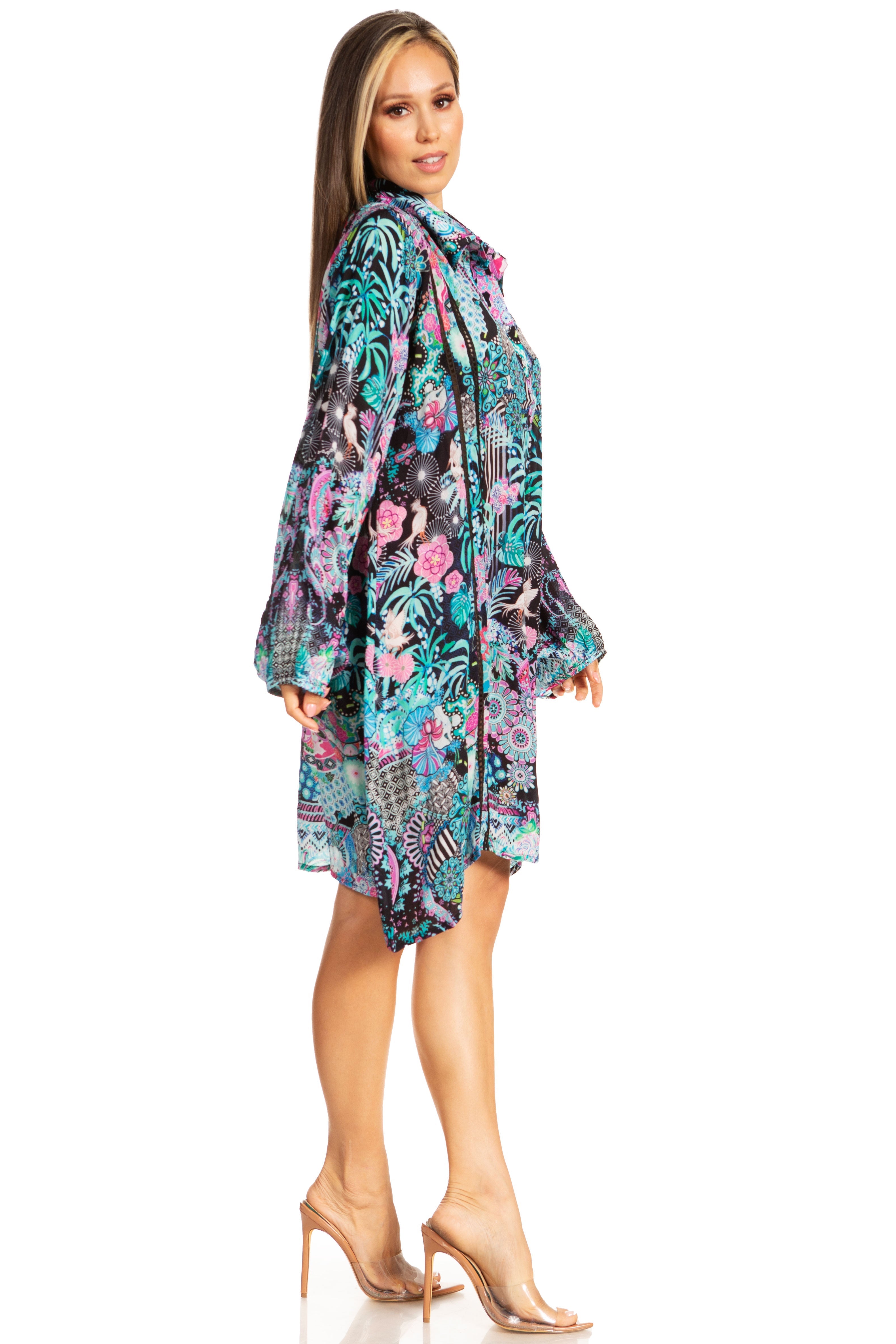 Woman wearing a colorful floral dress on a white background