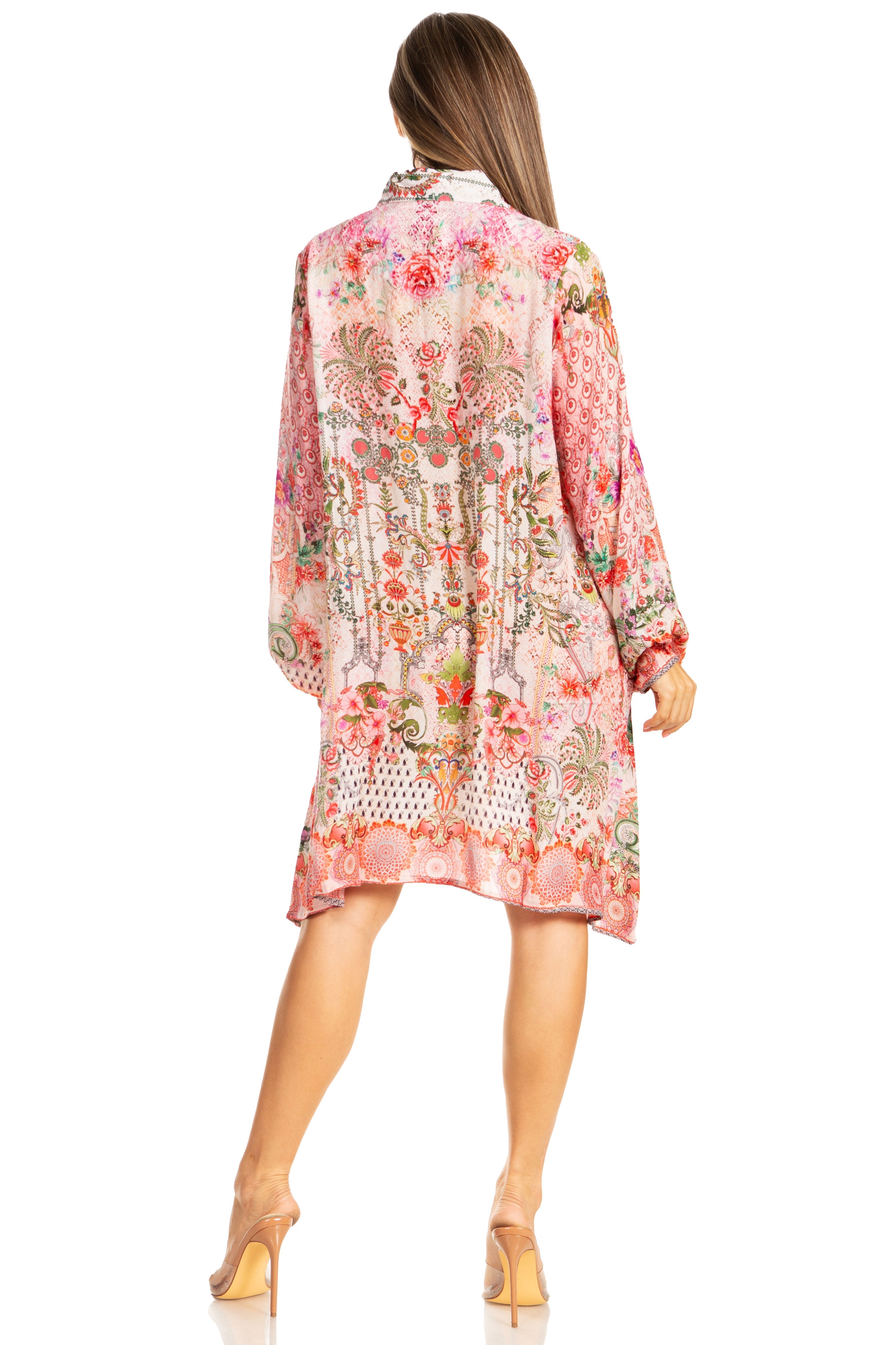 Woman wearing a floral kimono-style garment on a white background