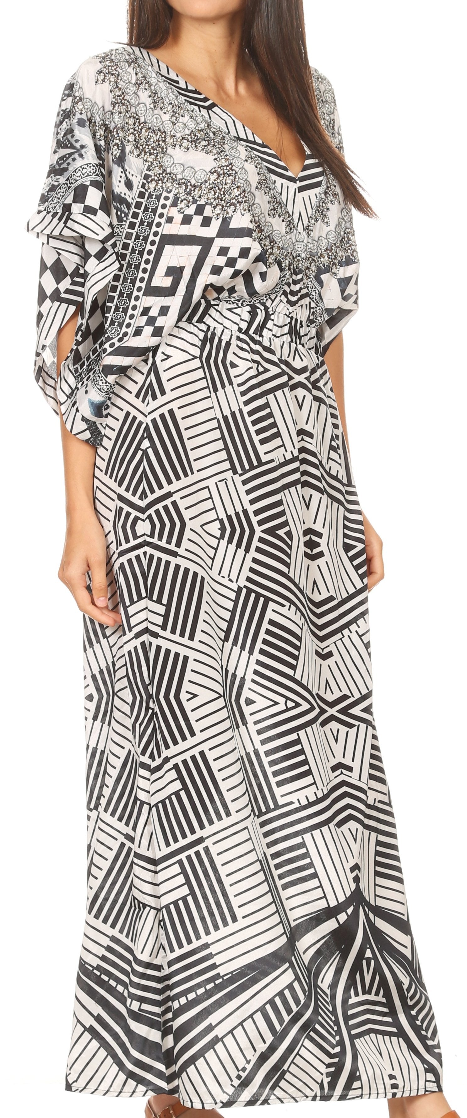 Woman wearing a long black and white patterned dress.