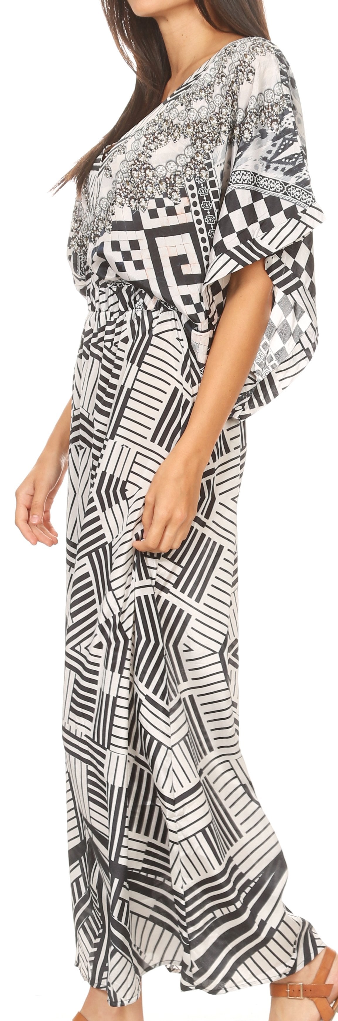 Woman wearing a black and white patterned dress on a white background