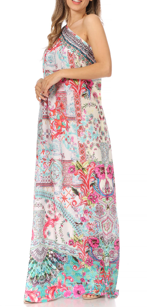 Woman wearing a colorful one-shoulder dress with a floral pattern on a white background