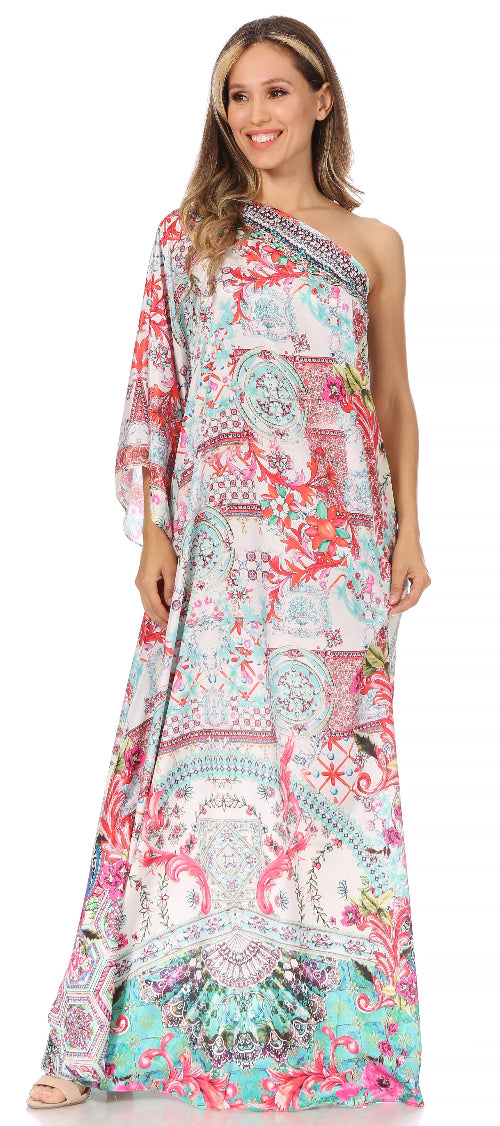 Woman wearing a colorful one-shoulder dress with a patterned design.