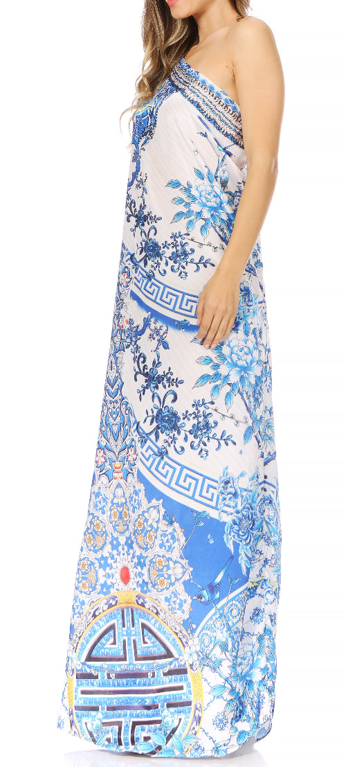 Woman wearing a floral patterned dress with a blue and white color scheme.