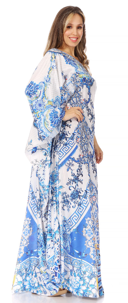 Woman wearing a long, patterned dress with blue and white design on a white background