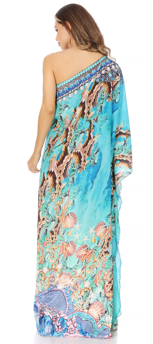Woman wearing a colorful one-shoulder dress with a floral pattern on a white background