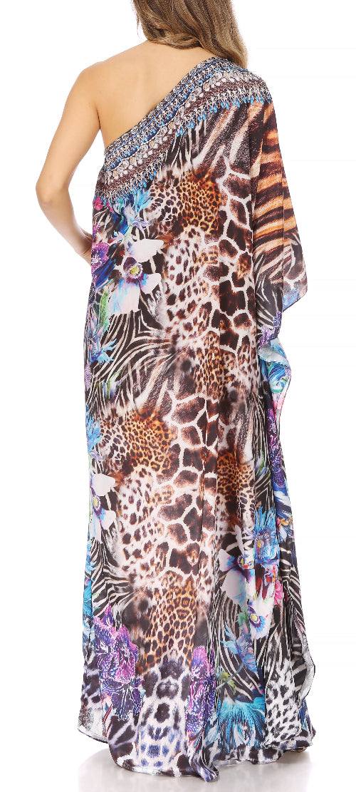 Woman wearing a colorful one-shoulder dress with animal print design on a white background