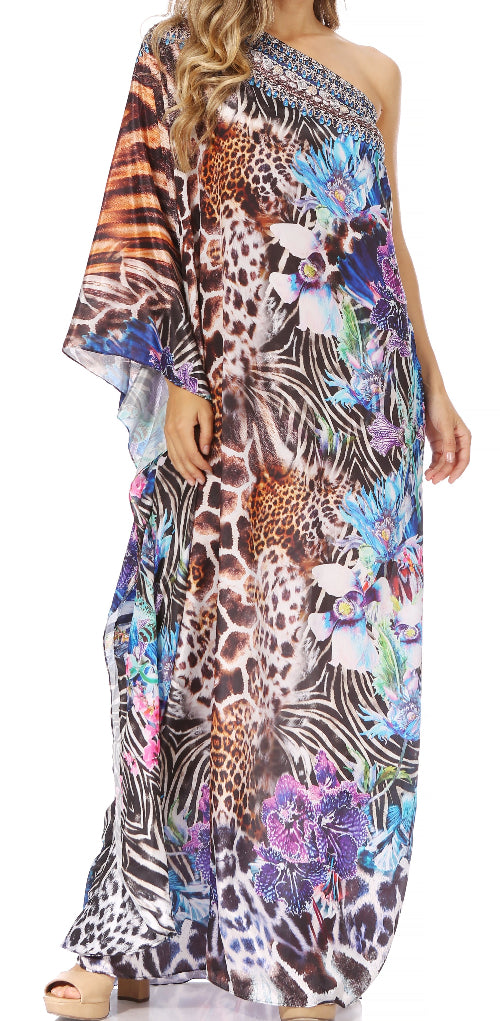 Woman wearing a colorful one-shoulder dress with animal print and floral design.