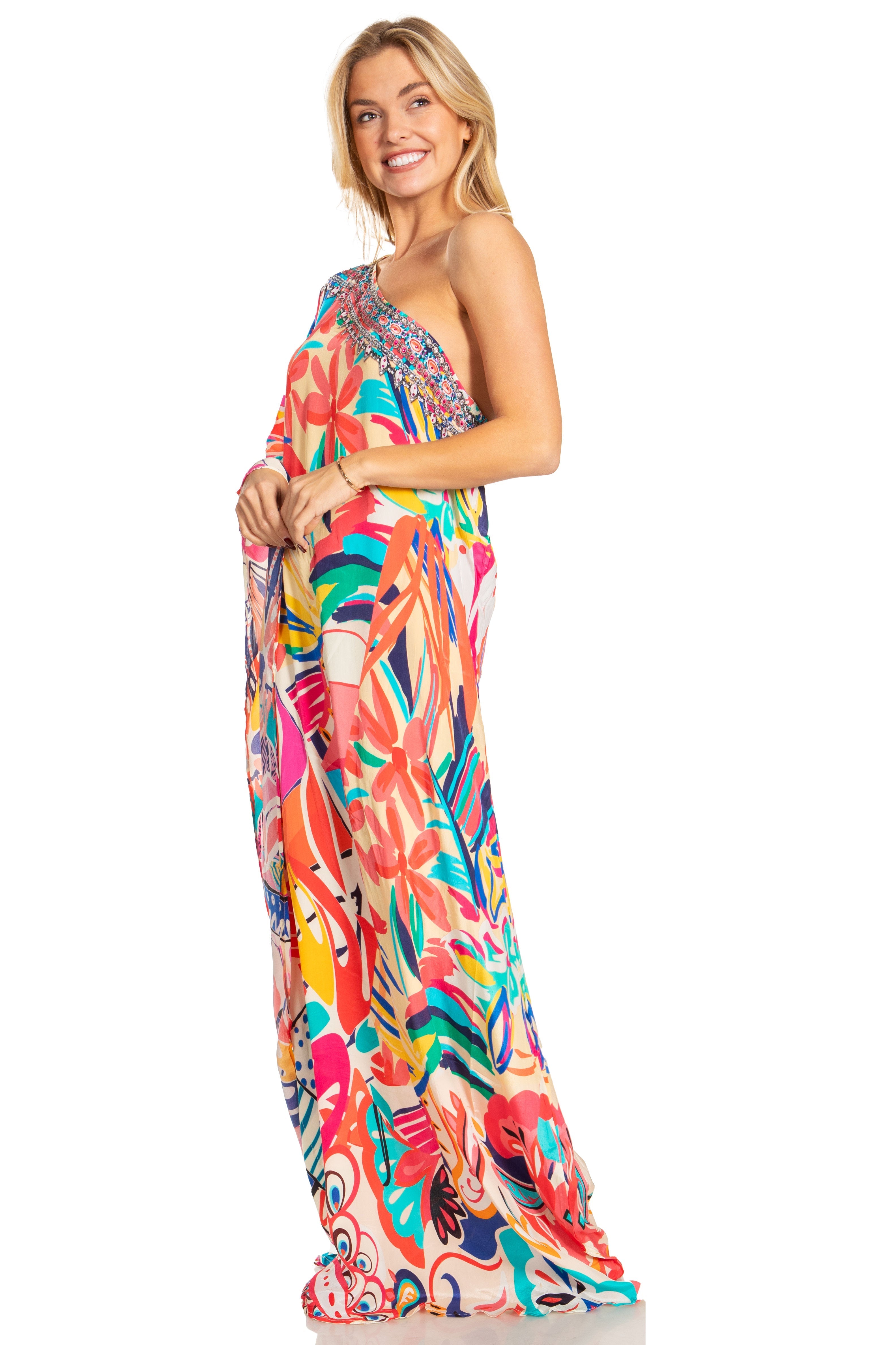 Woman wearing a colorful one-shoulder dress on a white background