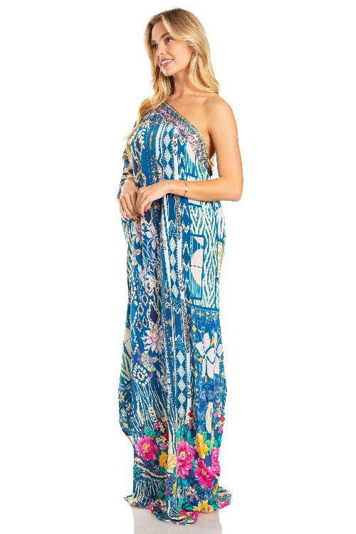 Woman wearing a colorful floral dress on a white background