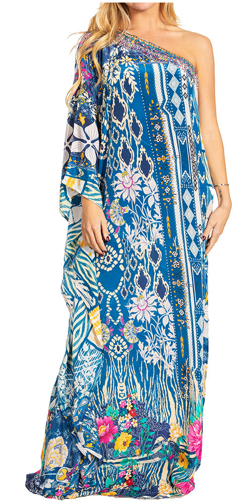 Woman wearing a blue floral one-shoulder dress on a white background