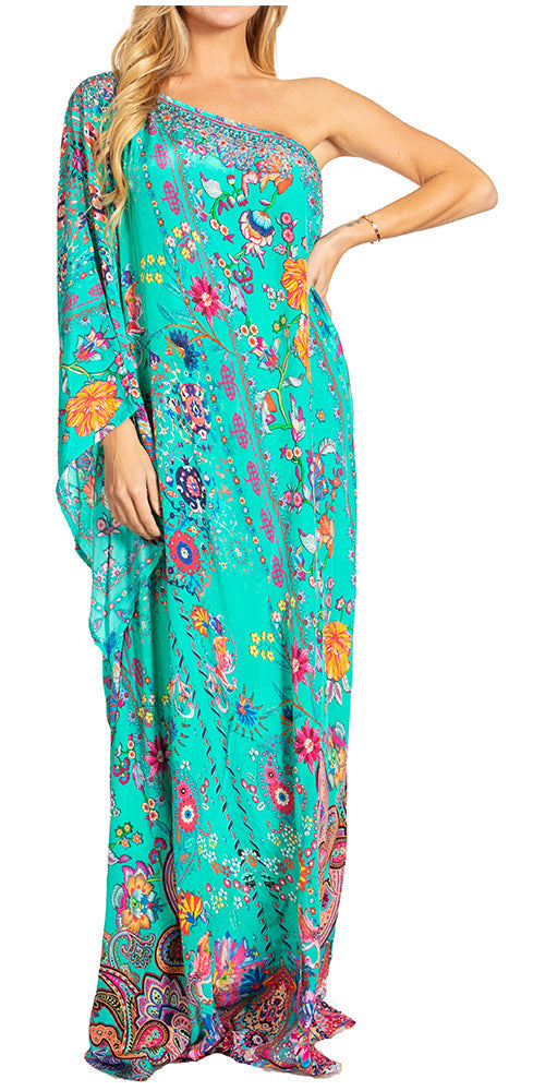 Woman wearing a floral one-shoulder dress with a colorful pattern on a white background