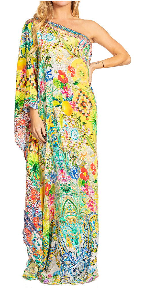 Woman wearing a colorful floral one-shoulder dress on a white background