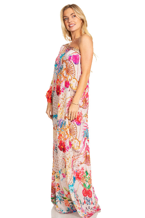 Woman wearing a colorful floral dress on a white background