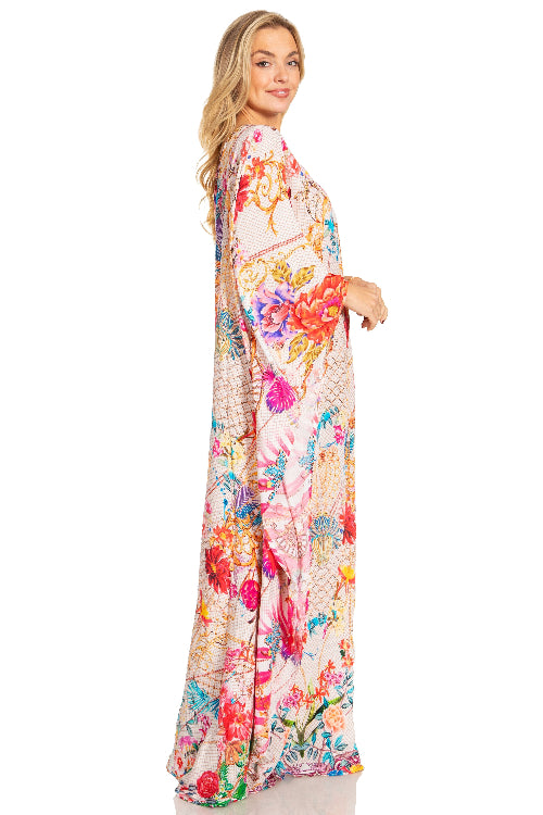 Woman wearing a colorful floral dress on a white background