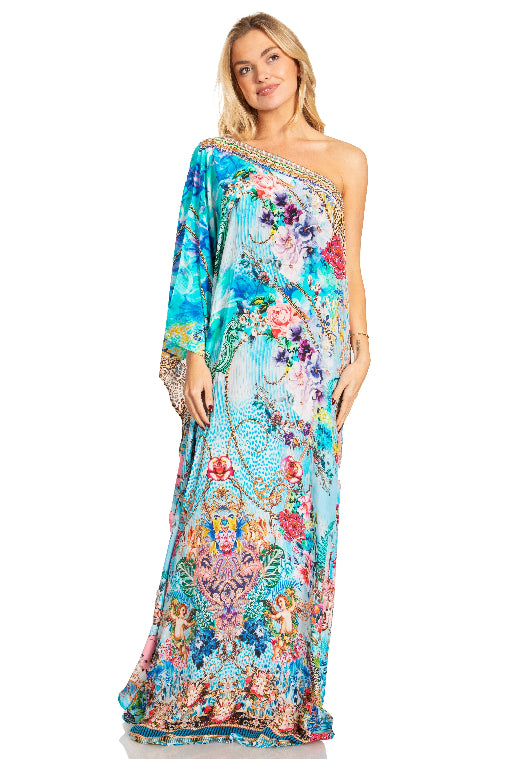 Woman wearing a colorful floral dress on a white background