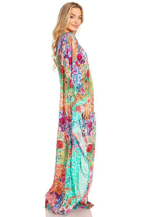 Woman wearing a colorful floral dress on a white background