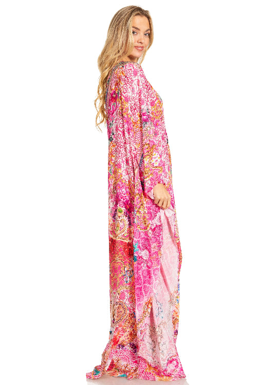 Woman wearing a colorful patterned dress on a white background